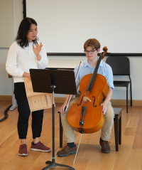Cello professor coaching a young student