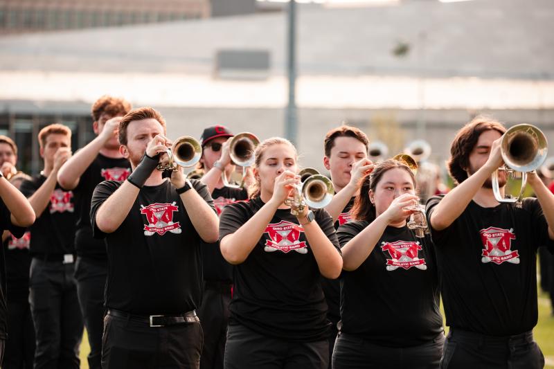 Athletic Band trumpet players performing, facing camera