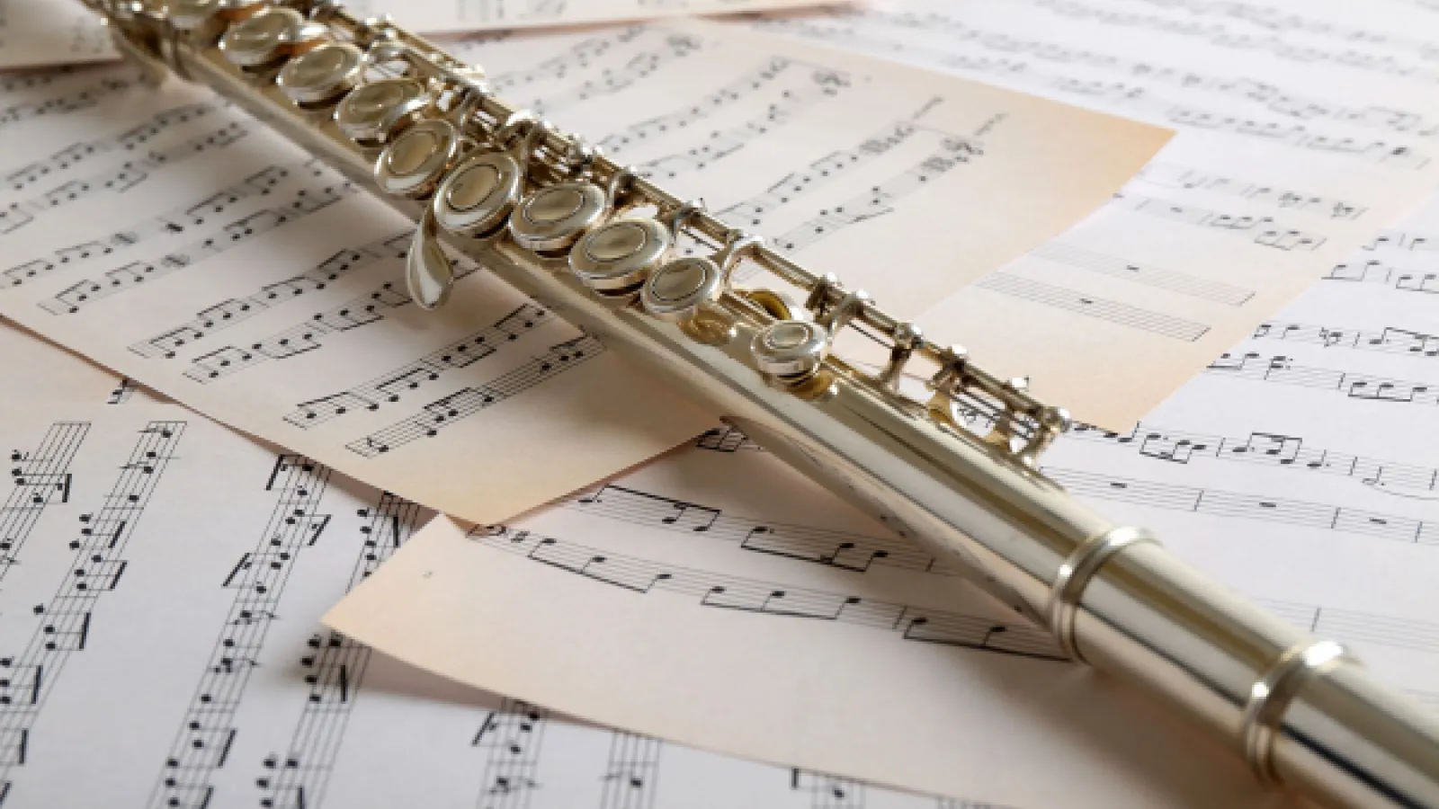Flute on top of sheet music