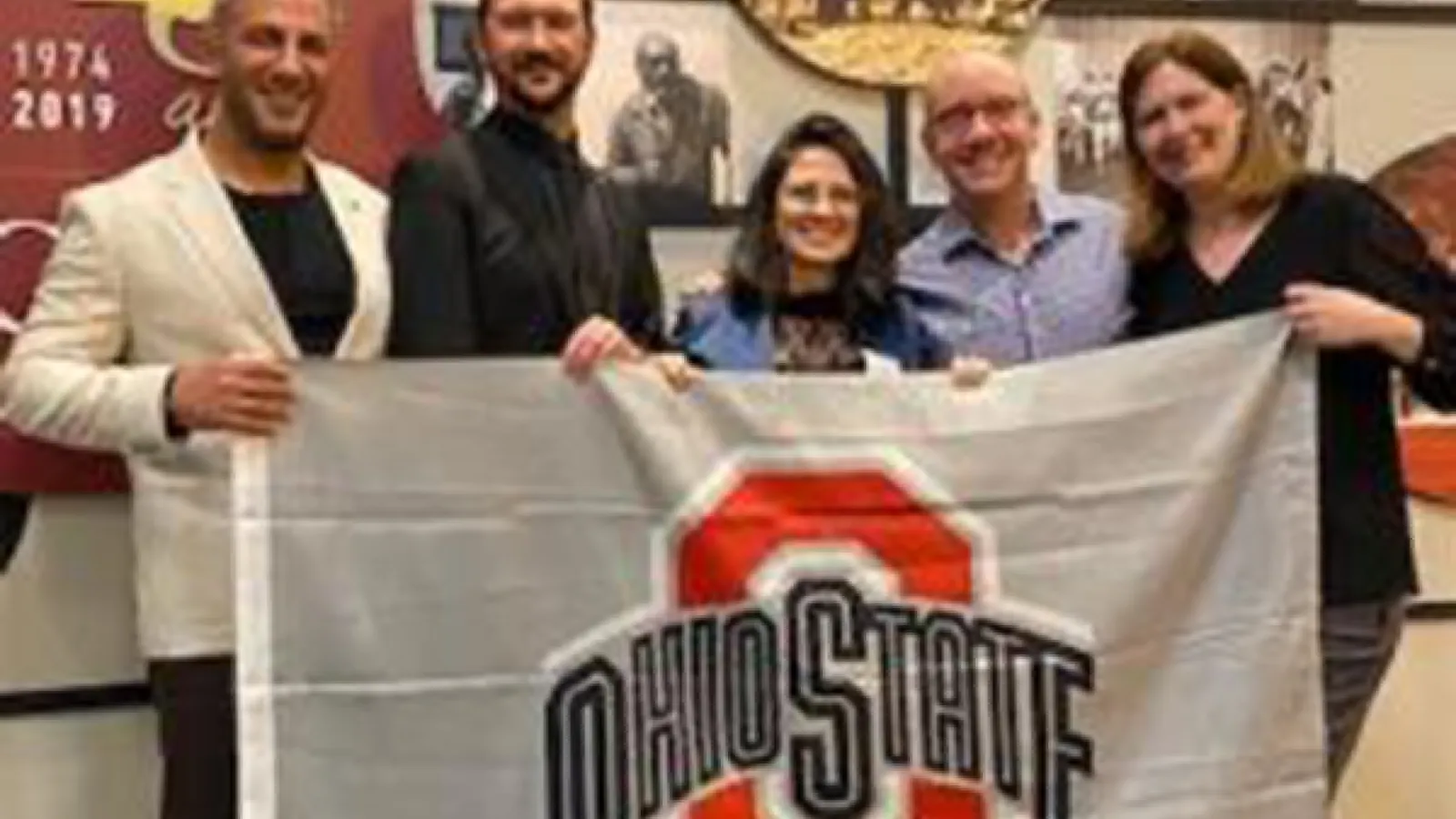 Ohio State delegation in Brazil, holding Block O flag