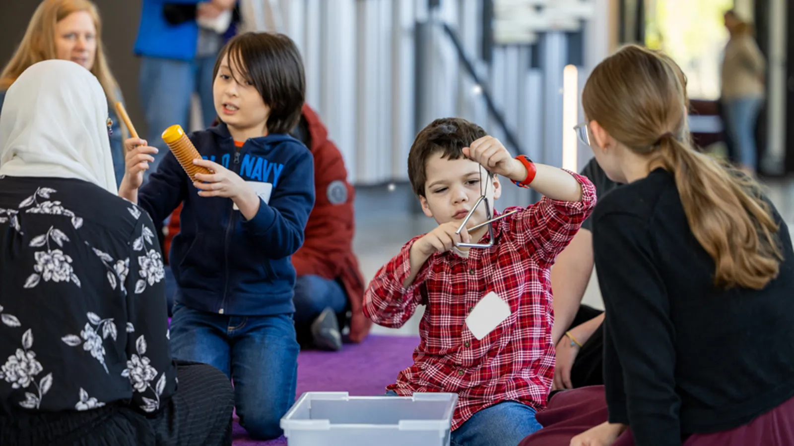 Children playing with percussion instruments