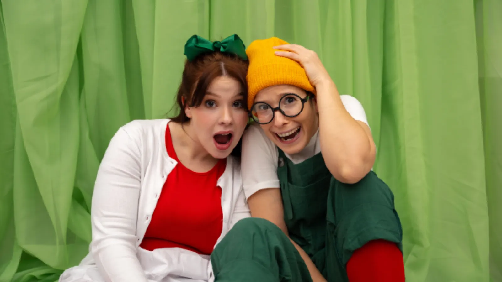 Girl and boy in costume looking surprised