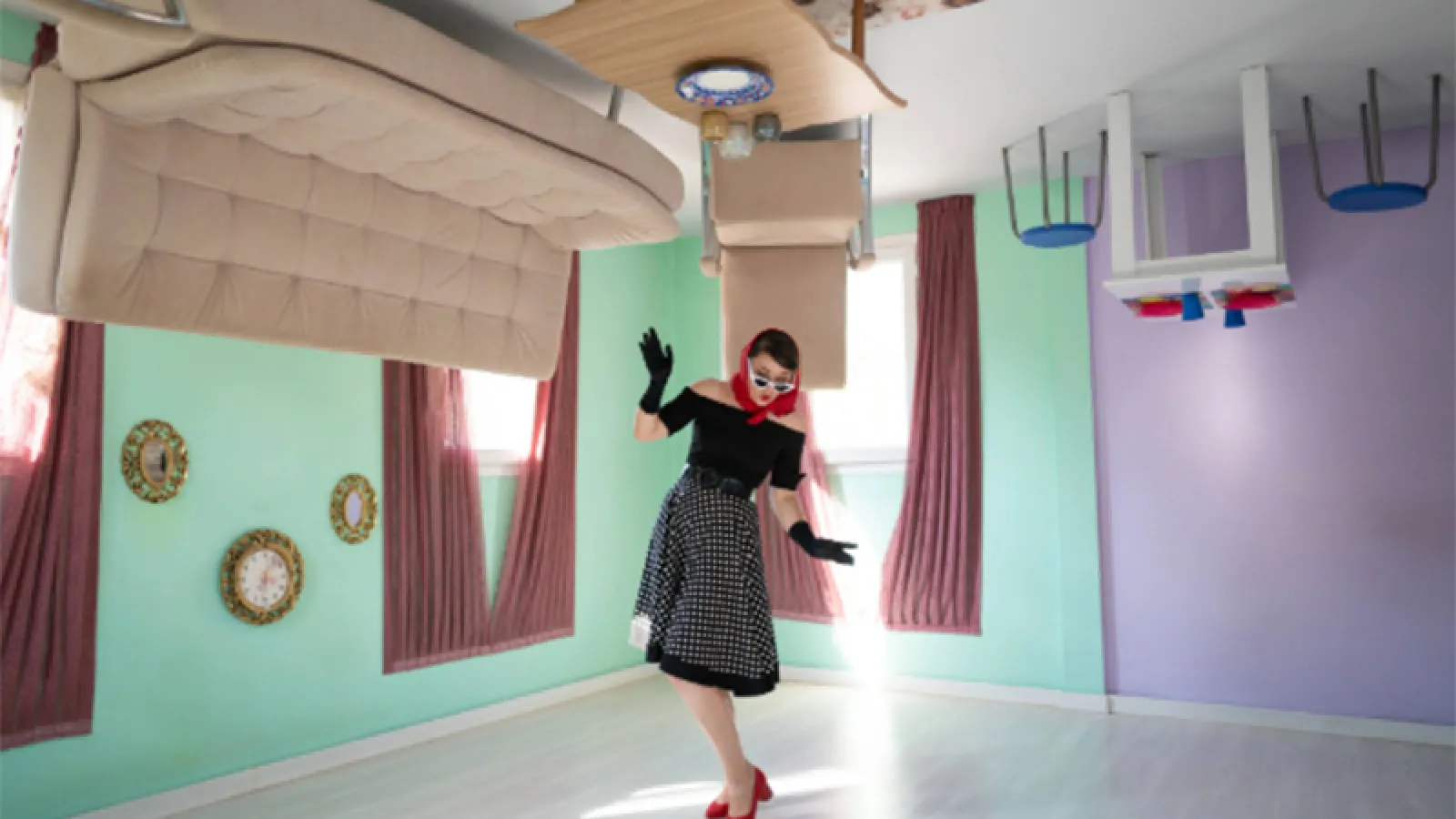 Woman standing in upside-down room