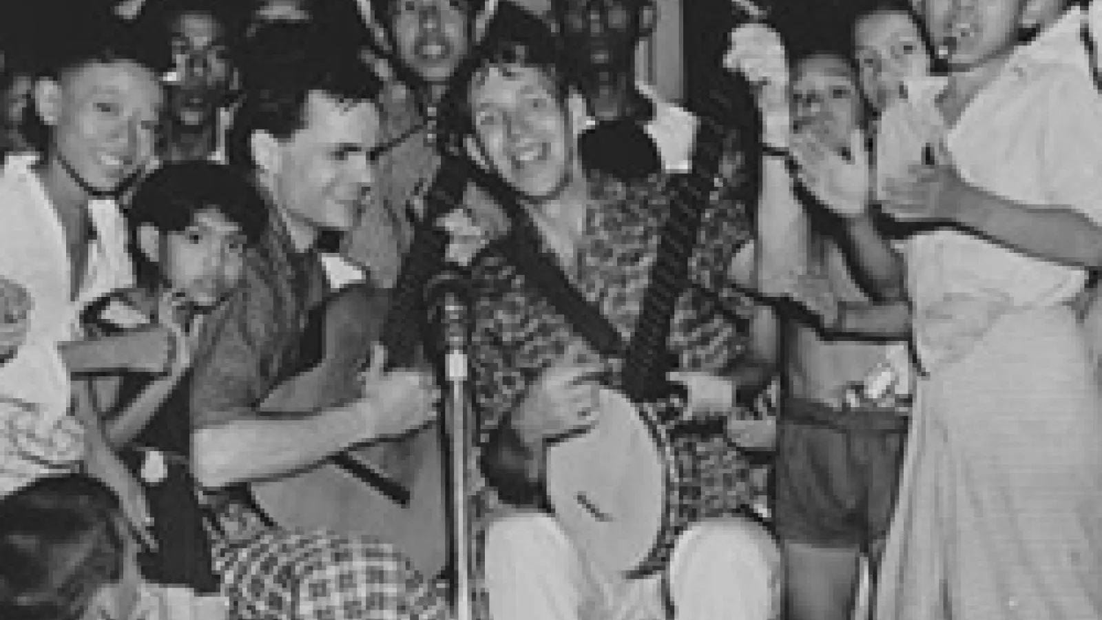 Bill Crofut and Steve Addiss, American folk singers, with children in Burma (now Myanmar). Photo courtesy of Danielle Fosler-Lussier.
