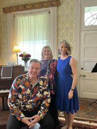 Laura Portune, Caroline Hartig and Ed Bak posing at the piano at Mt. Oval