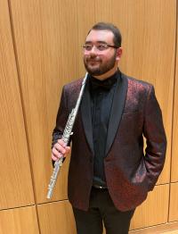 Braden holding his flute.