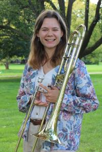 Girl holding trombone