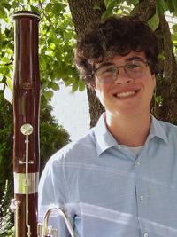 Man holding a bassoon