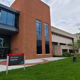 South facade of Weigel Hall behind the Timashev Music Building