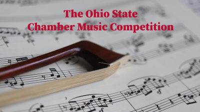 Musical score with violin bow lying on top