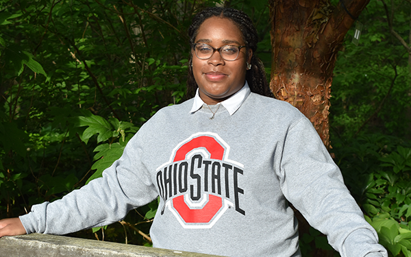 Anaiyah Rogers standing outside with an Ohio State crewneck on