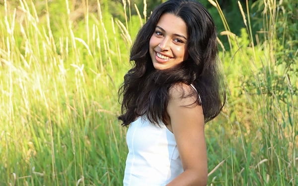 Emelina Pappalardo standing outside in a field of grass
