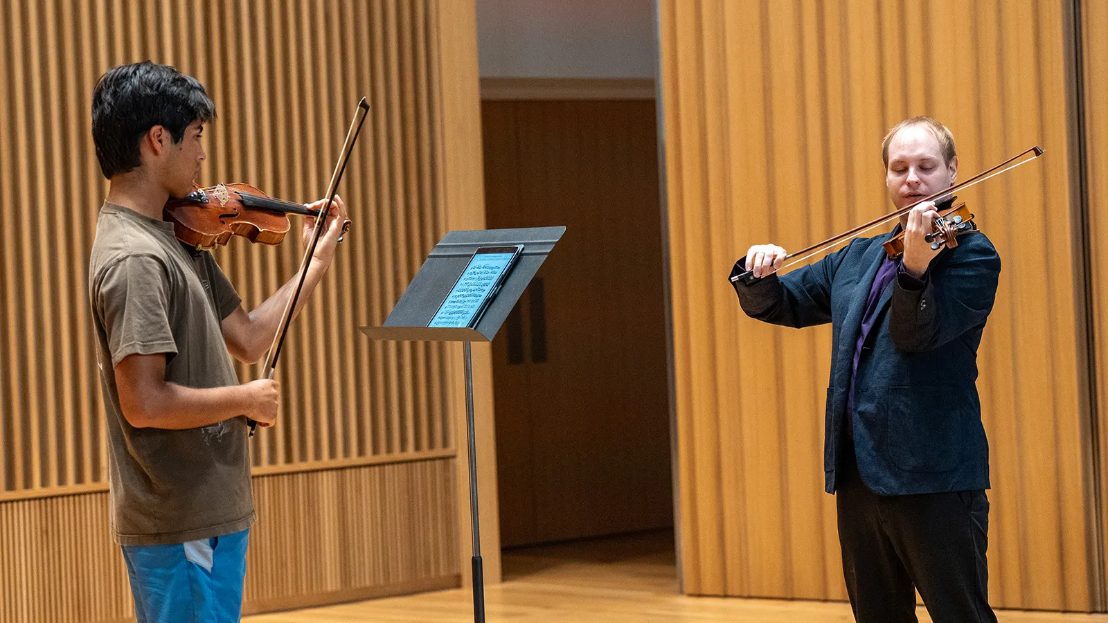 Andrii Isakov playing an excerpt for a violin student