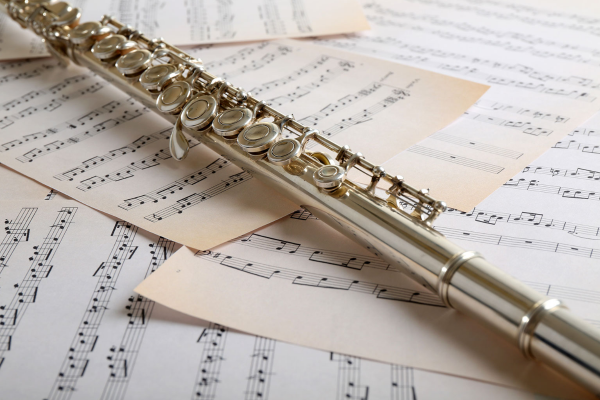 Flute on top of sheet music