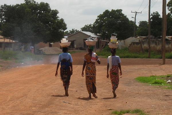 African women walking in their village