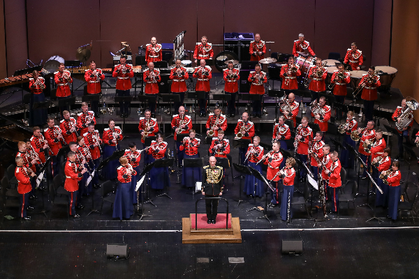 United States Marine Band standing on stage in uniforms