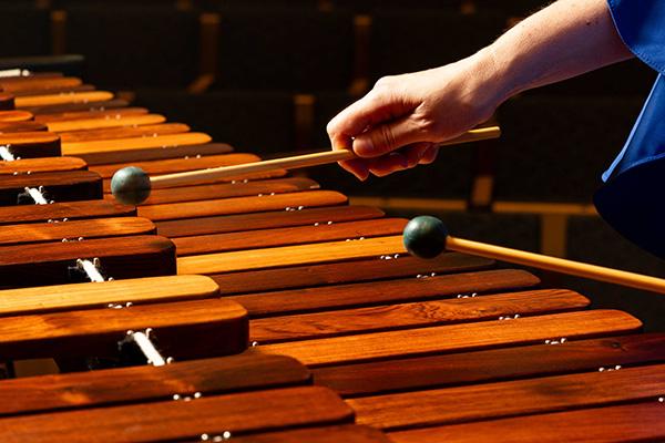Percussionist's hands playing marimba