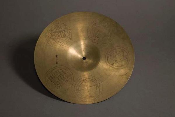 Drum cymbal with carved numerological designs (University of Chicago)