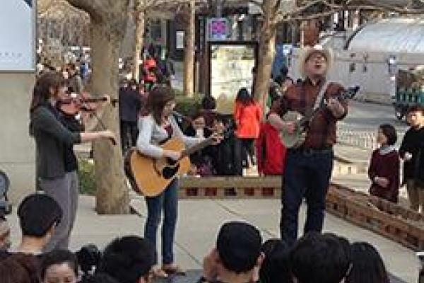 Trio performing in China square