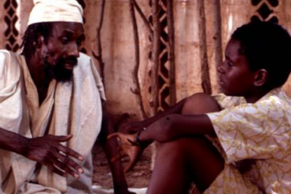 Griot teaching young Keita (image from the film)