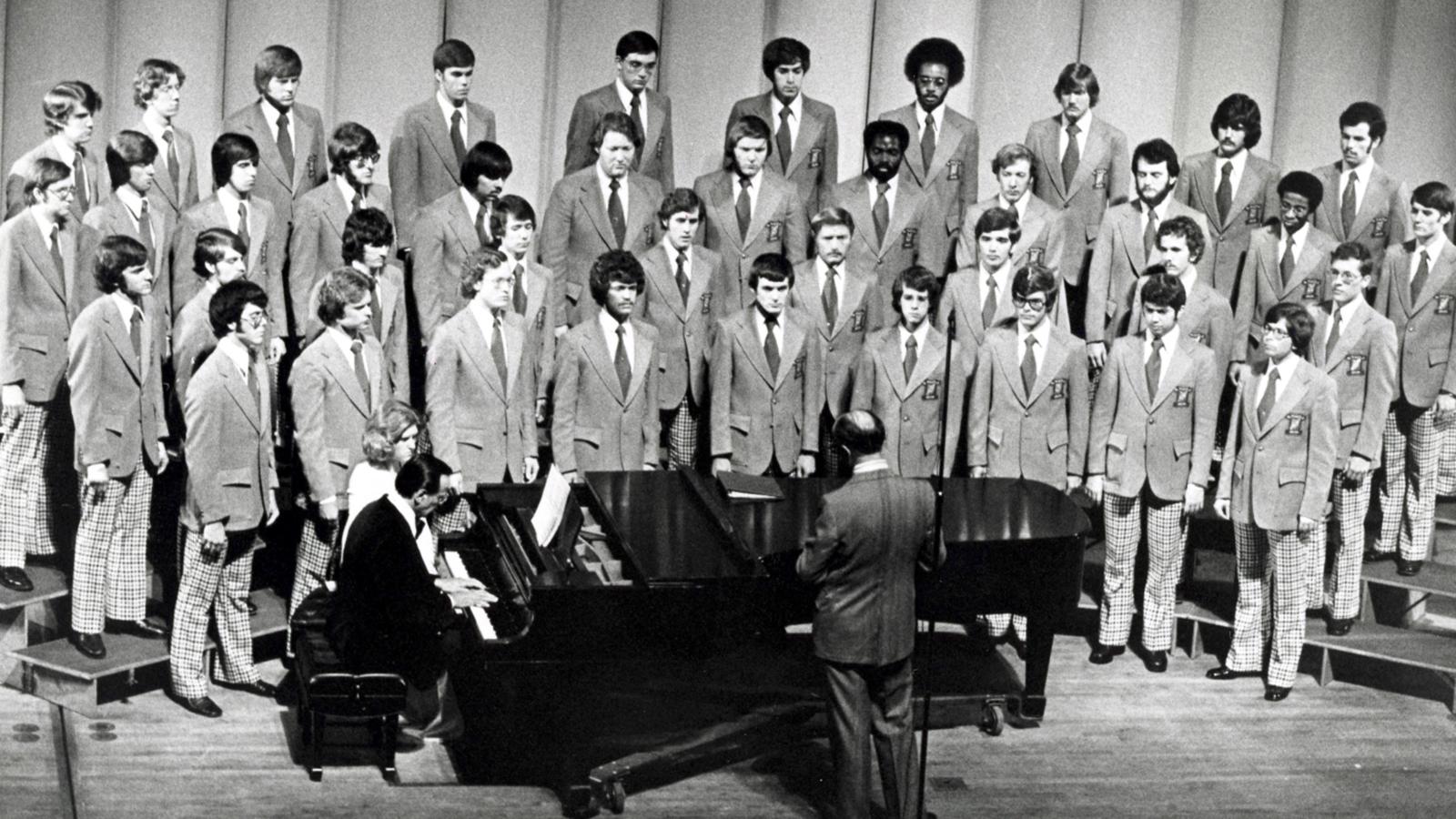 Men's Glee Club 1976, onstage around piano