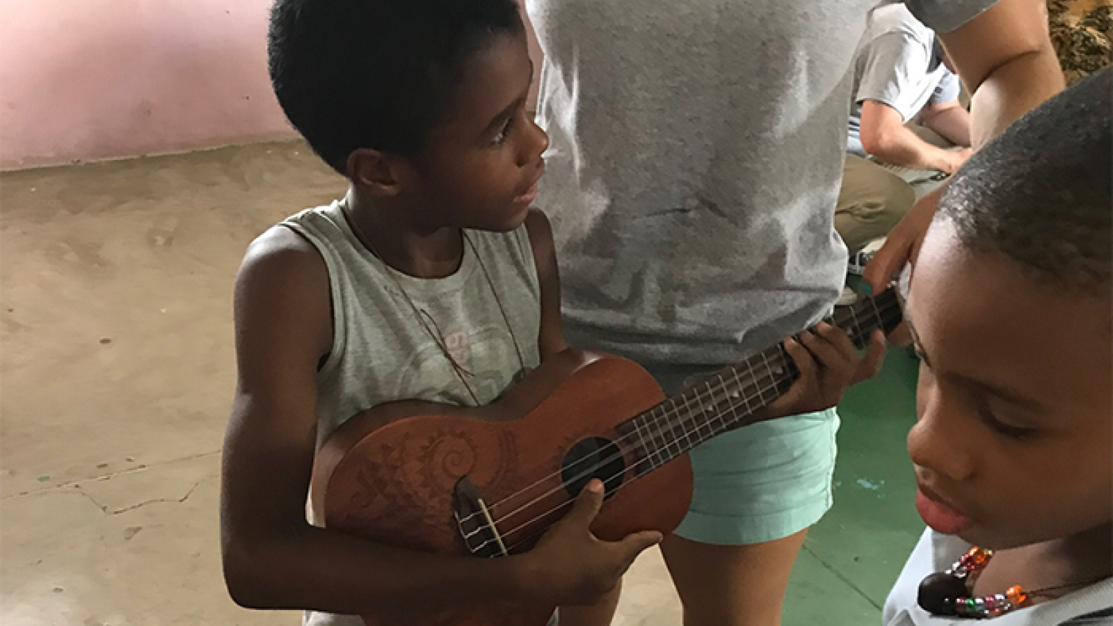 Child playing ukulele