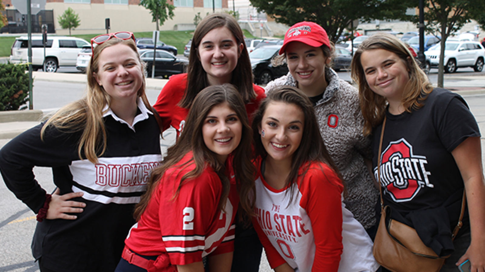 Soprano 2's posing for a picture during a tailgate sing