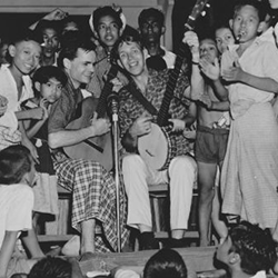 Bill Crofut and Steve Addiss, American folk singers, with children in Burma (now Myanmar). Photo courtesy of Danielle Fosler-Lussier. Bill Crofut and Steve Addiss, American folk singers, with children in Burma (now Myanmar). Photo courtesy of Danielle Fosler-Lussier.